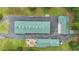 Aerial view of the main building, the additional structure and the outdoor entertaining area at 14501 Woolsey Rd, Hampton, GA 30228