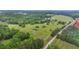 Aerial view of expansive property with mature trees and open fields at 14501 Woolsey Rd, Hampton, GA 30228