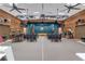 Expansive auditorium boasting log walls, ceiling fans, and a large stage area at 14501 Woolsey Rd, Hampton, GA 30228