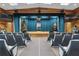 Large auditorium featuring wood paneling, a performance stage, and comfortable seating at 14501 Woolsey Rd, Hampton, GA 30228