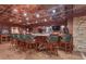 A finished basement bar area with multiple televisions, custom cabinets and wood paneling at 14501 Woolsey Rd, Hampton, GA 30228