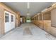 Interior of horse barn featuring multiple stalls, concrete floors and ample space for horses and equipment at 14501 Woolsey Rd, Hampton, GA 30228