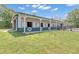 Exterior view of horse barn featuring multiple stalls, white siding and green accents perfect for equine activities at 14501 Woolsey Rd, Hampton, GA 30228