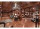 Expansive basement area with decorative ceiling, plush seating, and wood floors throughout at 14501 Woolsey Rd, Hampton, GA 30228