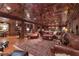 Basement living area featuring plush seating, wood floors, and a fireplace for cozy nights at 14501 Woolsey Rd, Hampton, GA 30228