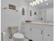 Bathroom featuring subway tile, a toilet, vanity and gold fixtures at 14501 Woolsey Rd, Hampton, GA 30228