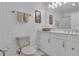 Bathroom featuring subway tile, a toilet, vanity and a basket on the counter at 14501 Woolsey Rd, Hampton, GA 30228