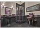 A rustic bathroom features a granite floor, modern glass enclosed shower, and custom vanity at 14501 Woolsey Rd, Hampton, GA 30228