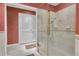 Bathroom featuring a walk-in shower with bronze fixtures and elegant tiled walls at 14501 Woolsey Rd, Hampton, GA 30228