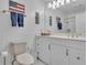 Bathroom featuring subway tile, a toilet, vanity and gold fixtures at 14501 Woolsey Rd, Hampton, GA 30228
