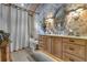 Cozy bathroom featuring a tub/shower and a stylish wood vanity at 14501 Woolsey Rd, Hampton, GA 30228