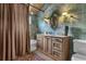 Bathroom features a combination tub and shower and a spacious vanity at 14501 Woolsey Rd, Hampton, GA 30228