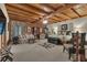 Expansive bedroom suite featuring wood-beamed ceilings and a comfortable seating area at 14501 Woolsey Rd, Hampton, GA 30228