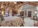 Roomy bedroom with vaulted ceiling and rustic wooden beams at 14501 Woolsey Rd, Hampton, GA 30228