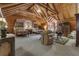 Spacious suite with vaulted wood ceilings, two queen beds, and comfortable seating area at 14501 Woolsey Rd, Hampton, GA 30228