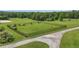 Spacious, fenced dog park area with shelters and play equipment providing a secure and fun environment for pets at 14501 Woolsey Rd, Hampton, GA 30228