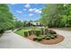 Long driveway leading to log-style home and surrounding landscaping at 14501 Woolsey Rd, Hampton, GA 30228
