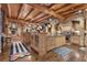 Expansive kitchen featuring butcher block islands, exposed beams, stone accents, and a large hood at 14501 Woolsey Rd, Hampton, GA 30228