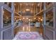 Inviting great room with soaring ceilings, wood beams, and a grand staircase at 14501 Woolsey Rd, Hampton, GA 30228