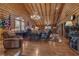 Inviting log cabin office space featuring a stately desk, comfortable seating, and natural light at 14501 Woolsey Rd, Hampton, GA 30228