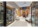 Spacious office featuring display cabinets, neutral walls, and comfortable seating area at 14501 Woolsey Rd, Hampton, GA 30228