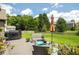 Lovely backyard with a well-maintained lawn, patio seating, and shade umbrella for outdoor enjoyment at 1511 Rocky Knoll Ln, Dacula, GA 30019