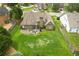 Aerial view of large backyard featuring a patio, lush lawn, and privacy fencing, perfect for outdoor enjoyment at 1511 Rocky Knoll Ln, Dacula, GA 30019