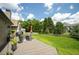 Well-manicured backyard with a wooden deck, patio seating, and a spacious lawn perfect for outdoor living at 1511 Rocky Knoll Ln, Dacula, GA 30019