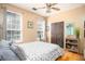 Cozy bedroom with wood floors, ceiling fan, and natural light at 1511 Rocky Knoll Ln, Dacula, GA 30019