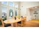 Bright dining room with large windows, offering a view of the outdoors and seating for six at 1511 Rocky Knoll Ln, Dacula, GA 30019