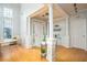 Bright foyer with hardwood floors, tall ceilings, columns, and lots of natural light at 1511 Rocky Knoll Ln, Dacula, GA 30019