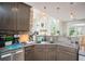 Modern kitchen featuring stainless steel appliances, granite countertops, and a stylish backsplash at 1511 Rocky Knoll Ln, Dacula, GA 30019