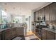 Modern kitchen equipped with stainless steel appliances, granite countertops, and ample storage space at 1511 Rocky Knoll Ln, Dacula, GA 30019