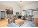 Spacious living room showcasing an open floor plan with hardwood floors and modern sofas at 1511 Rocky Knoll Ln, Dacula, GA 30019