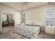 Spacious main bedroom with hardwood floors and large windows offering natural light at 1511 Rocky Knoll Ln, Dacula, GA 30019