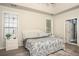Bright main bedroom with tray ceiling, windows, and soft carpet at 1511 Rocky Knoll Ln, Dacula, GA 30019