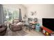Bright office featuring a desk, chair, hardwood floors, and large windows at 1511 Rocky Knoll Ln, Dacula, GA 30019