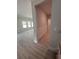 Hallway area with wood-look floors and decorative trim at 3065 Zodiac Ct, Lawrenceville, GA 30044