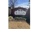 Brick sign for the Twin Oaks community featuring greenery and colorful flowers at the base at 746 Great Oak Pl, Villa Rica, GA 30180