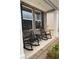 Charming front porch with black rocking chairs and views of the neighborhood at 746 Great Oak Pl, Villa Rica, GA 30180