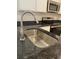 Modern kitchen sink with granite countertop, stainless steel faucet, and stainless steel appliances at 746 Great Oak Pl, Villa Rica, GA 30180
