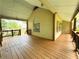 A covered porch with an open design, perfect for enjoying the peaceful surroundings and outdoor living at 851 Millvale Pl, Lawrenceville, GA 30044