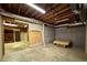 Unfinished basement with a day bed and storage shelves visible in the background at 851 Millvale Pl, Lawrenceville, GA 30044