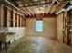 Unfinished basement featuring a utility sink, window, and exposed ceiling at 851 Millvale Pl, Lawrenceville, GA 30044