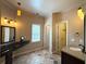 Elegant bathroom featuring a granite countertop, vanity, and decorative lighting fixtures at 851 Millvale Pl, Lawrenceville, GA 30044