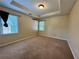 A serene bedroom featuring neutral tones, plush carpeting, and natural light from two windows at 851 Millvale Pl, Lawrenceville, GA 30044