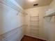Spacious walk-in closet featuring wire shelving and carpeted flooring at 851 Millvale Pl, Lawrenceville, GA 30044
