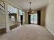 Elegant dining room featuring staircase, and large window at 851 Millvale Pl, Lawrenceville, GA 30044