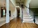 Spacious foyer with hardwood floors and staircase at 851 Millvale Pl, Lawrenceville, GA 30044