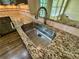 Close-up of a stainless steel kitchen sink with granite countertop at 851 Millvale Pl, Lawrenceville, GA 30044
